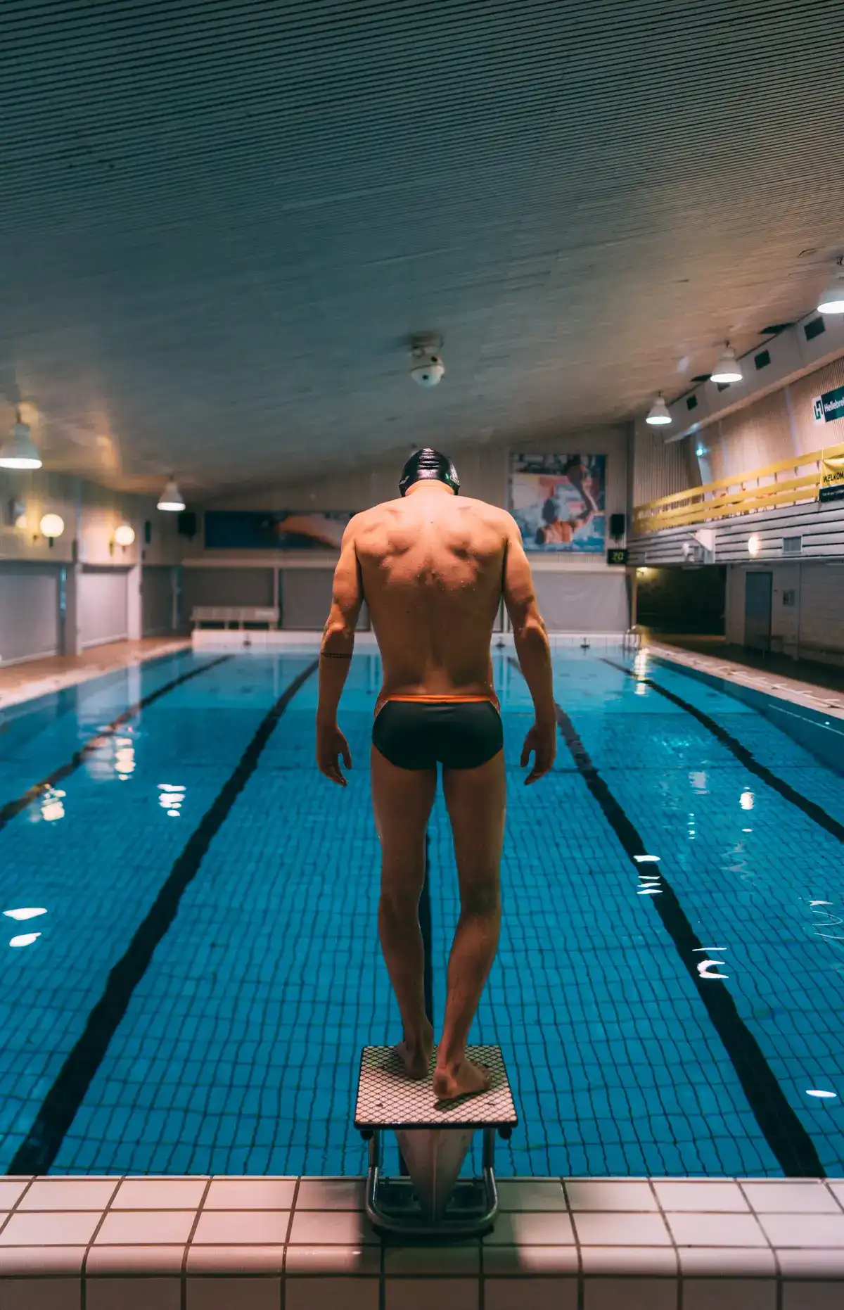Lane swimmer looking onto an emptry swimming pool